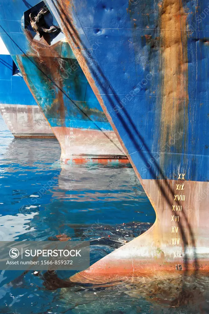Ships in port with oil slick around bow