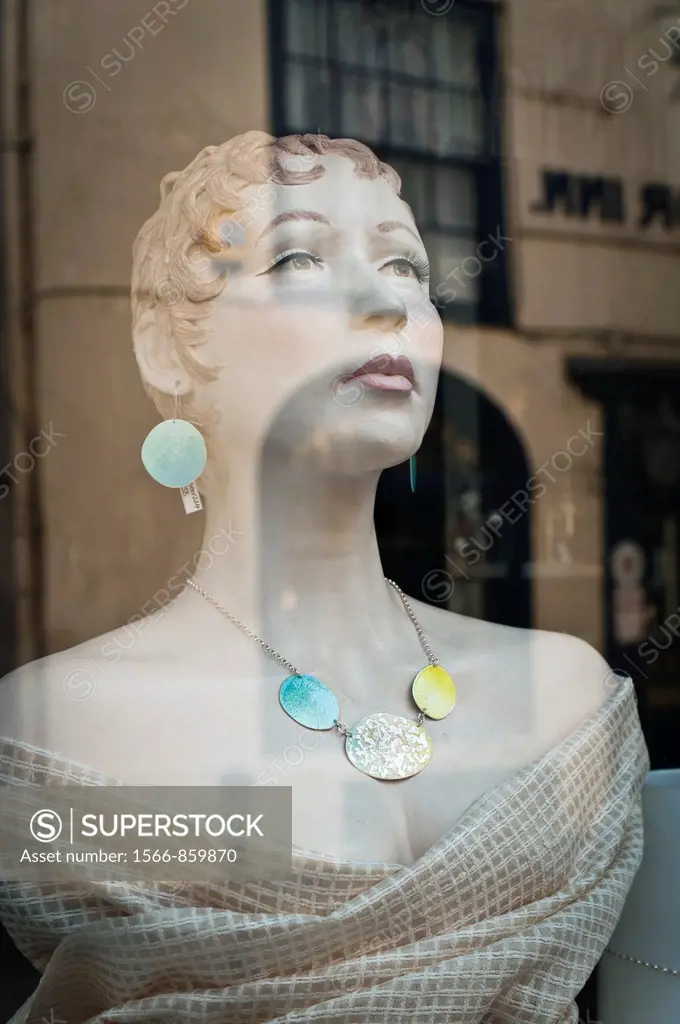 Shop dummy in jewelry store window, Hastings, East Sussex, England, UK