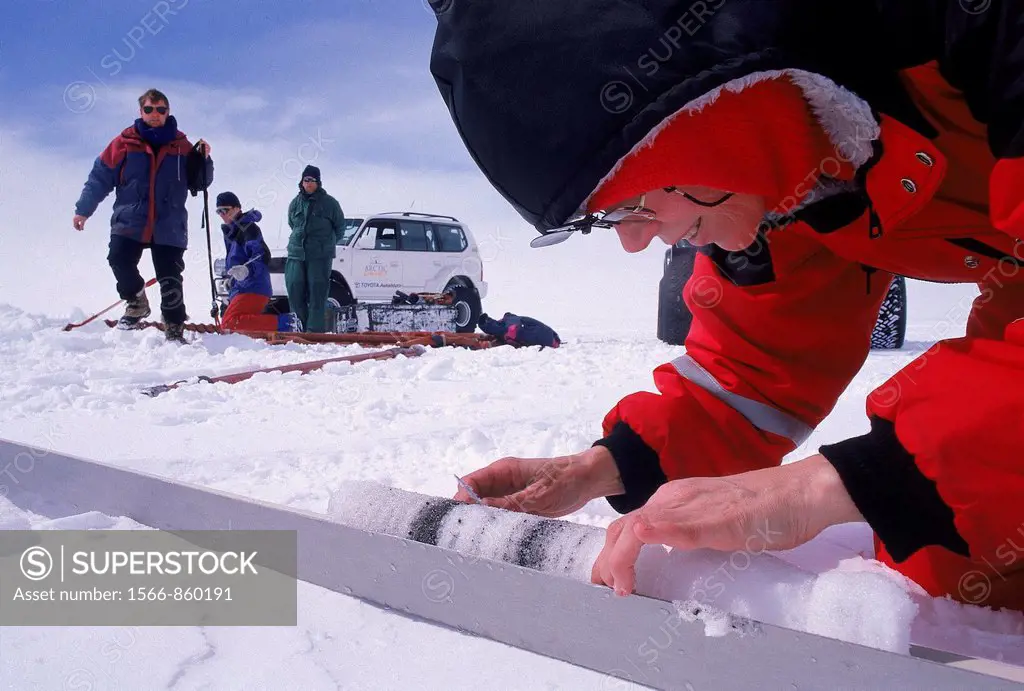Research Scientist Examining an Ice Core, Vatnajokull Ice Cap, Iceland