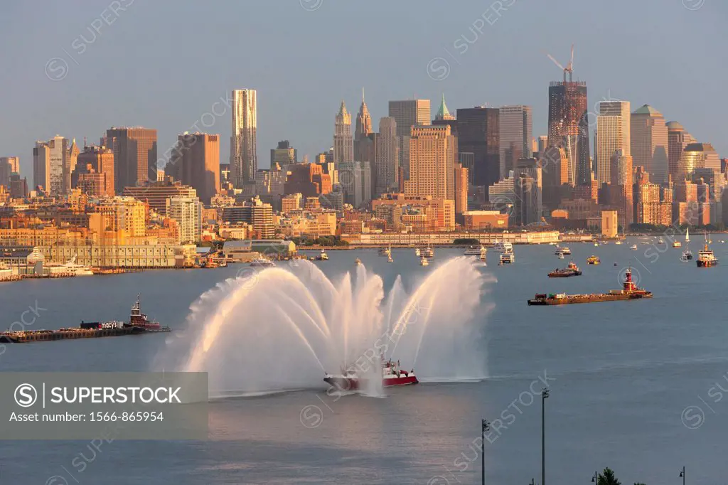 FDNY fire boat Marine 1 ´Three Forty Three´ puts on a water show on the Hudson river prior to the annual Macy´s Fourth of July fireworks on Monday, Ju...