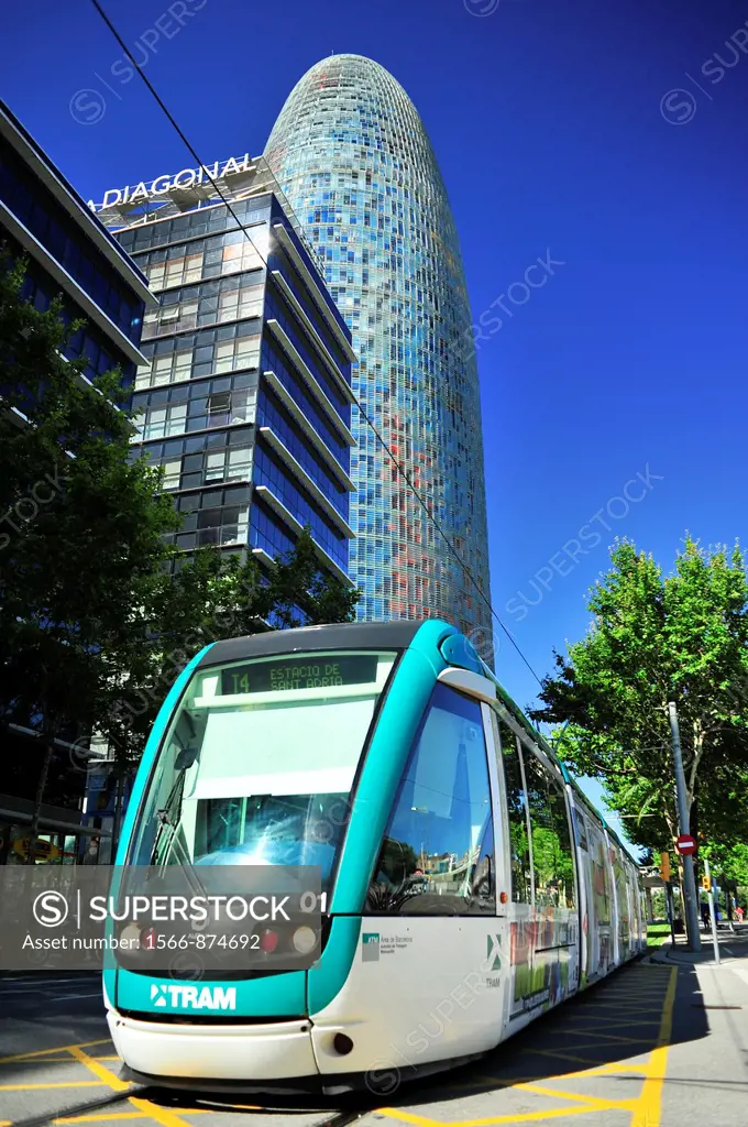 T4 Trambesós light rail tram, Agbar Tower in background, architect Jean Nouvel, distrito 22@, Barcelona, Catalonia, Spain