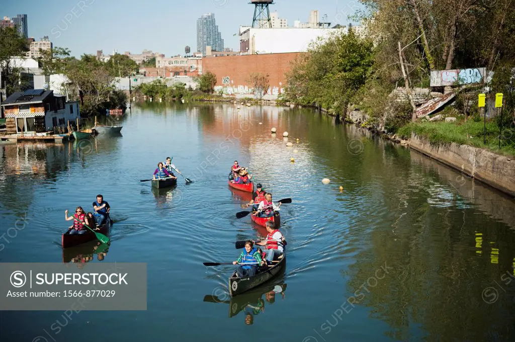 Canoers paddle the polluted inland waterway, the Gowanus Canal in Brooklyn in New York The polluted canal was recently designated a Superfund site tri...