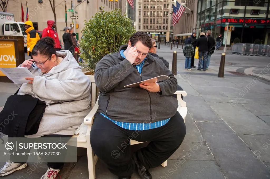 Participants weighing 500 pounds, right and 400 pounds. left. fill out their audition applications Hundreds of people line up outside of the NBC Exper...