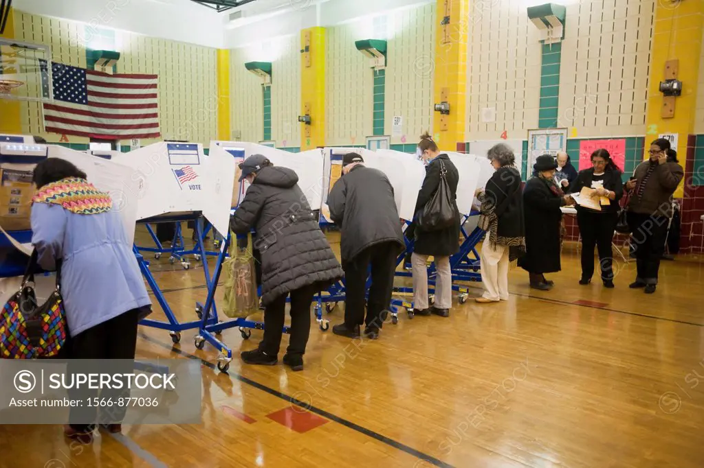 Voters cast their ballots in New York in Washington Heights on election day Voters for the first time in a general election in New York used electroni...