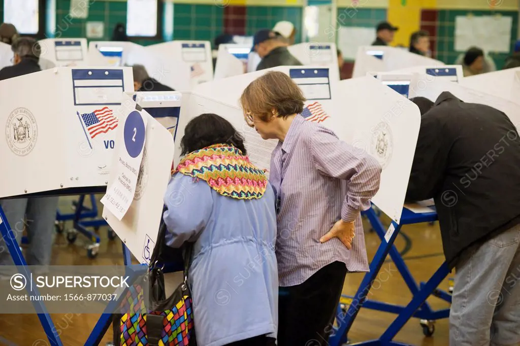 Voters cast their ballots in New York in Washington Heights on election day Voters for the first time in a general election in New York used electroni...