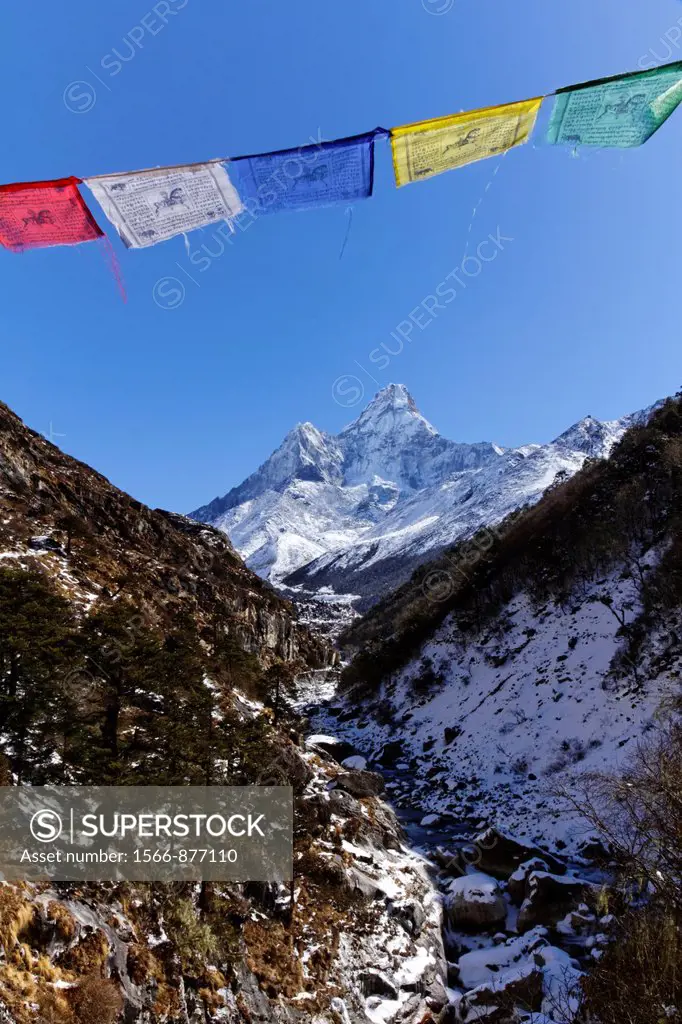 Buddhist prayer flags and Ama Dablam mountain, Everest Region, Nepal