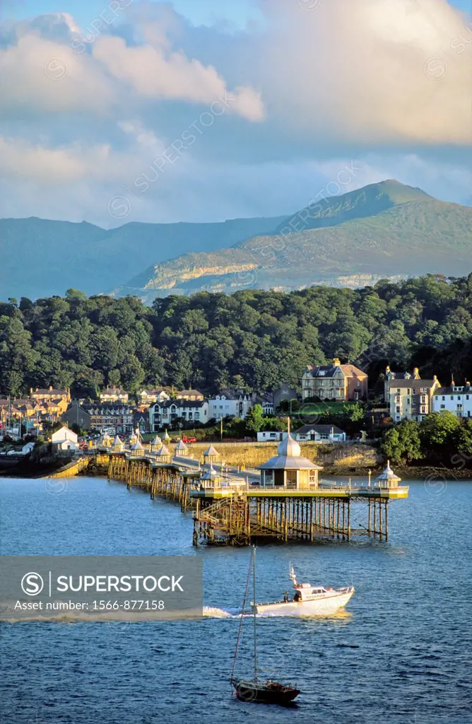Bangor Pier and town, Gwynedd, north Wales, UK  Looking across the Menai Strait from Anglesey to the mountains of Snowdonia