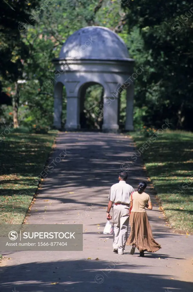 Local couple walking in Peradeniya Botanical Garden, Kandy, Sri Lanka