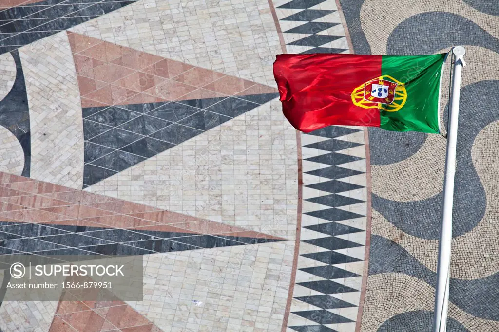 Flag of Portugal and a giant world map at the foot of the Monument to the Discoveries, Padrao dos Descobrimentos, Belem, Lisbon, Portugal, Europe