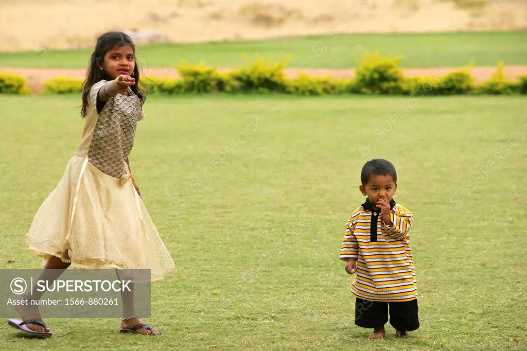 Young boy and sister in Hampi, a world heritage site in India.