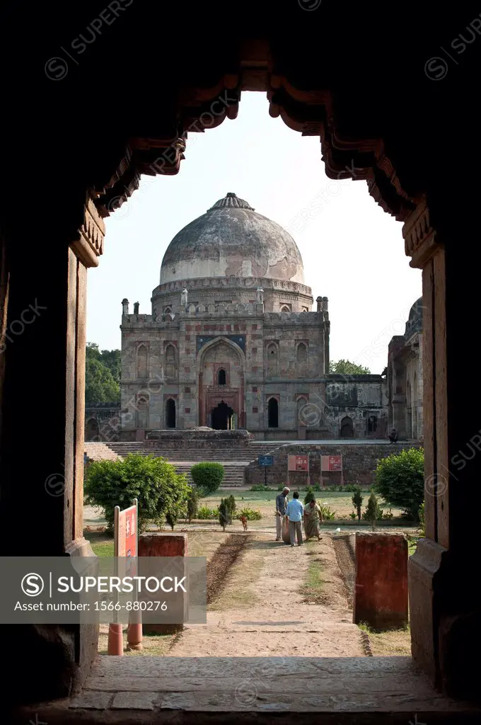 Bara Gumbad mosque viewd through the arch of Sheesh Gumbad, Lodi Gardens, New Delhi, India