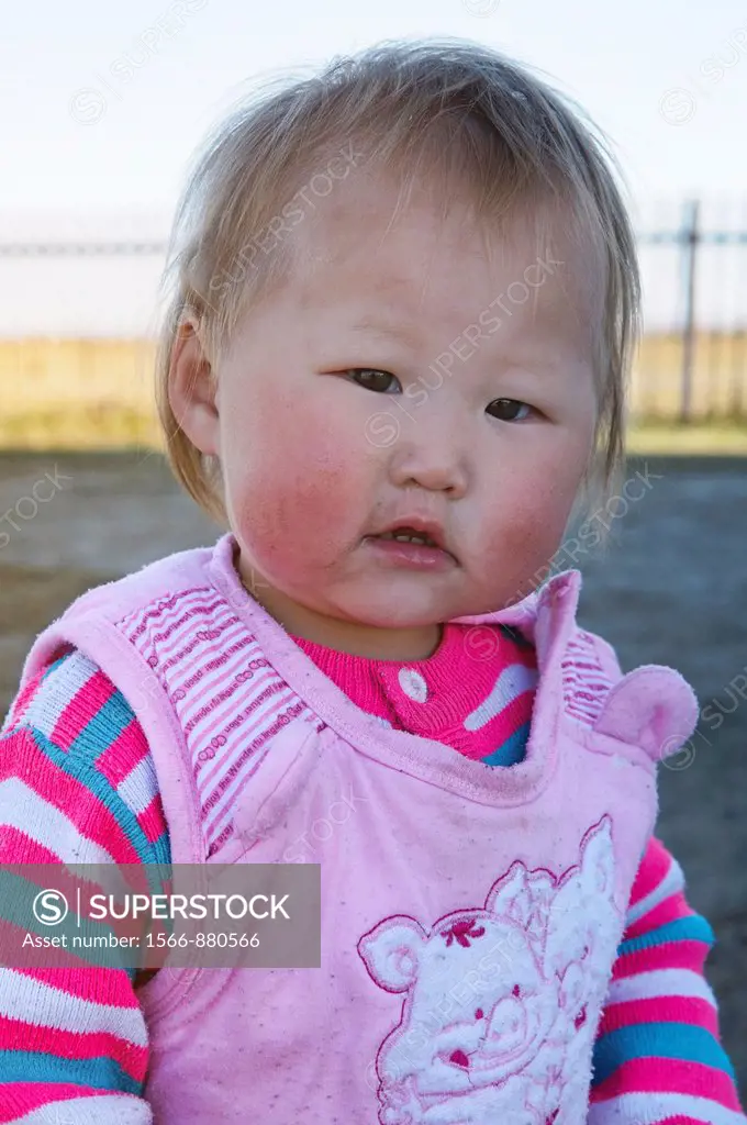 blond Mongolian baby in the Orkhon River Valley of Central Mongolia
