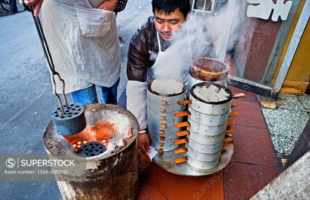 Cooking & selling dumplings, in Dazhalan Jie,Beijing, China