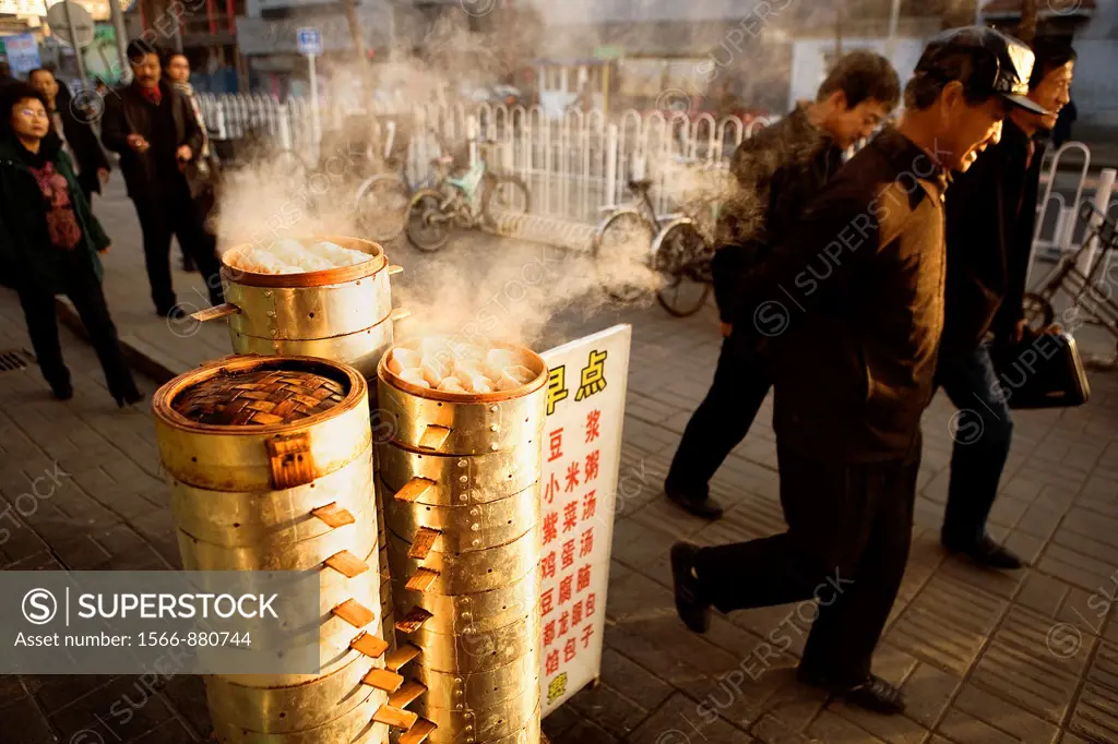 Cooking & selling dumplings, in Qianmen Dajie,Beijing, China