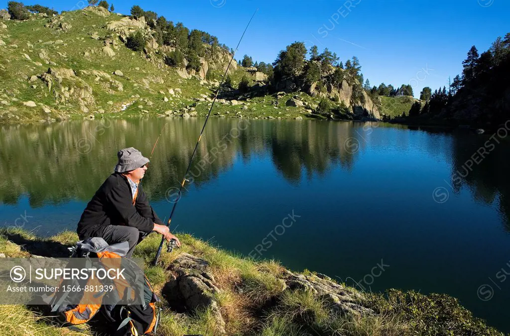 Estany Long, Fisherman,Colomèrs cirque,Aran Valley, Aigüestortes and Estany de Sant Maurici National Park,Pyrenees, Lleida province, Catalonia, Spain