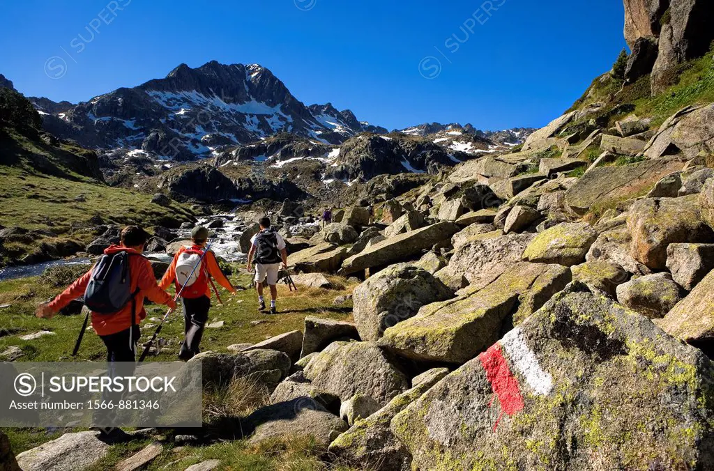 Trippers and Signposting of GR-11 in Circ de Colomers, near Obago lake,Aran Valley, Aigüestortes and Estany de Sant Maurici National Park,Pyrenees, Ll...