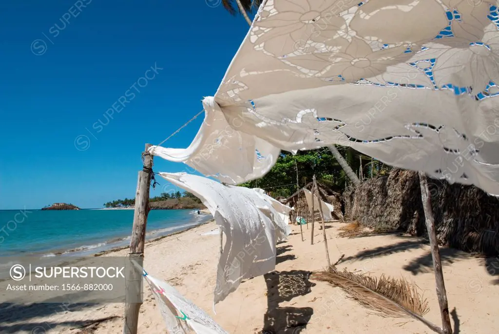 embroidered tablecloth on Andilana beach in the north-west part of Nosy Be island, Republic of Madagascar, Indian Ocean