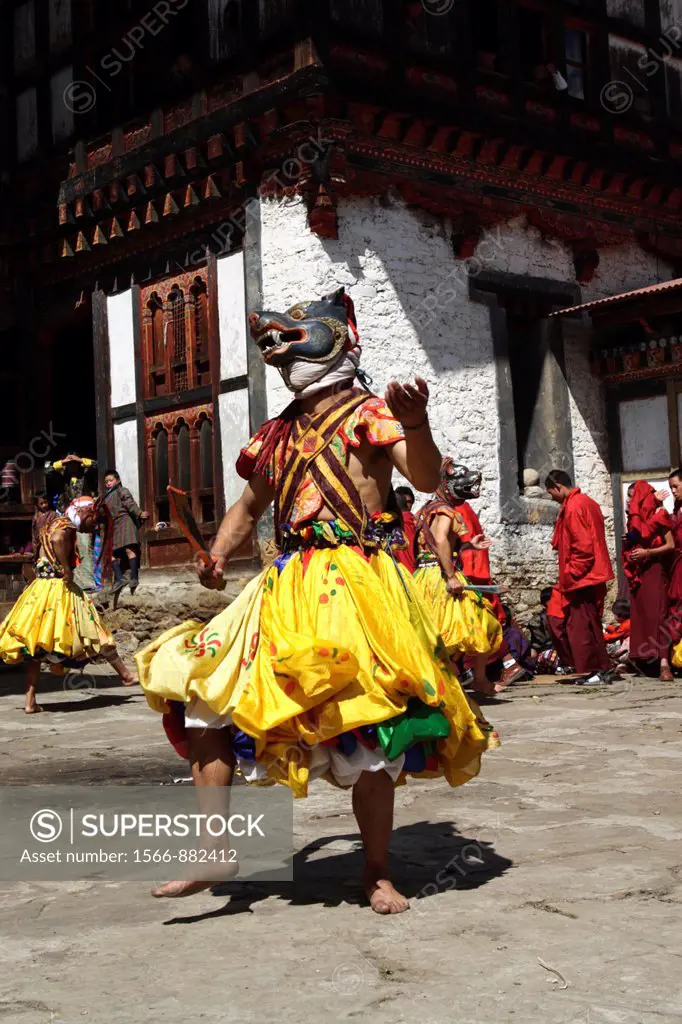 Masked dancers at the Tangbi Mani Tsechu festival, Bumthang, Bhutan