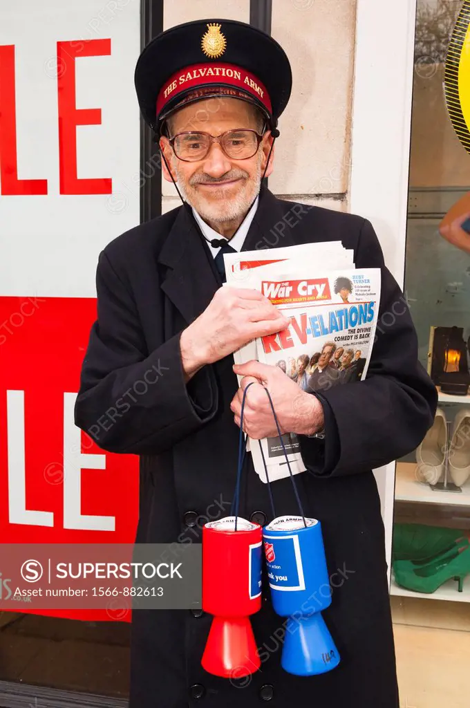 A volunteer charity worker collecting money for The Salvation Army in Norwich , Norfolk , England , Britain , Uk
