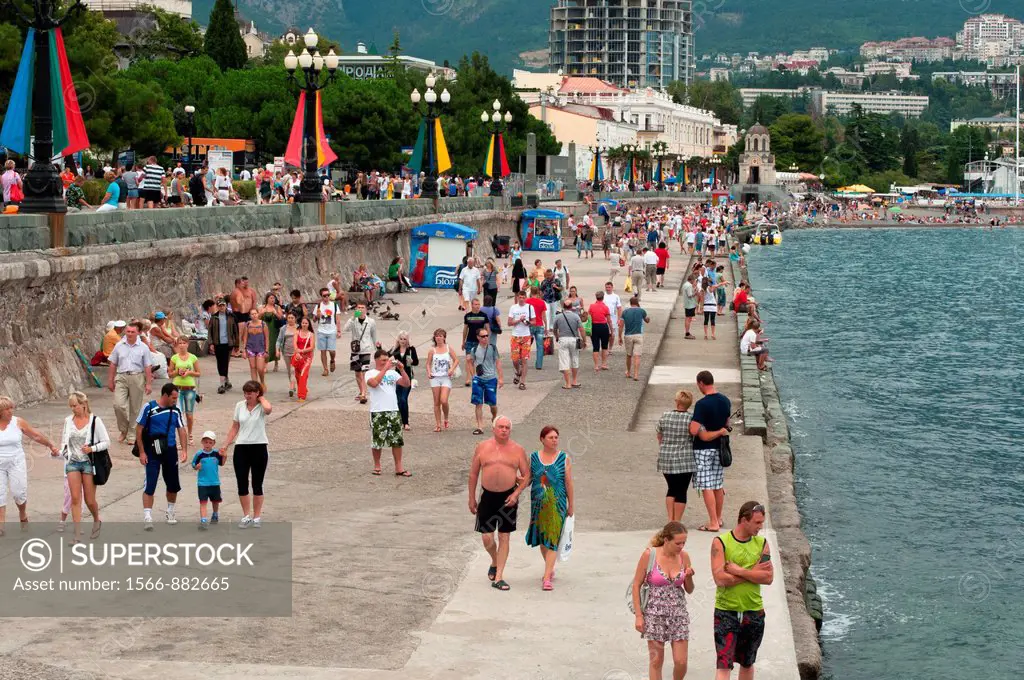 People walking along the promenade at the seaside town of Yalta, Ukraine