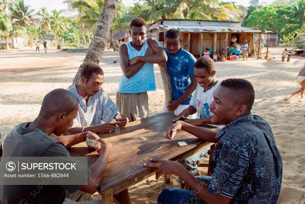 men playing dominoes, village of Ambatozavavy, Nosy Be island, Republic of Madagascar, Indian Ocean