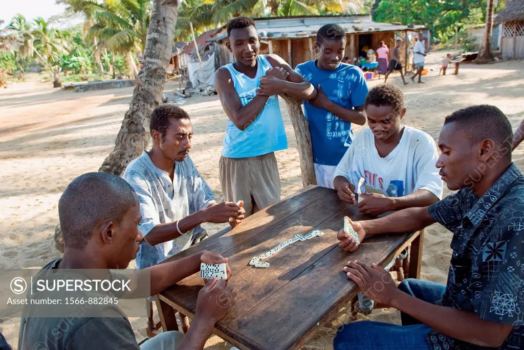 men playing dominoes, village of Ambatozavavy, Nosy Be island, Republic of Madagascar, Indian Ocean