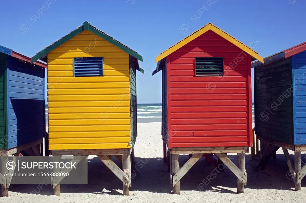 Colorful beach huts at the sandy beach of Muizenberg with blue sky, False Bay near Cape Town, South Africa