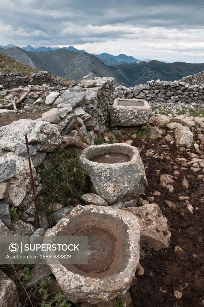 Old stone sinks, used by cowherds in the high pastures of the Taygetus mountains, Outer Mani, Peloponnese, Greece
