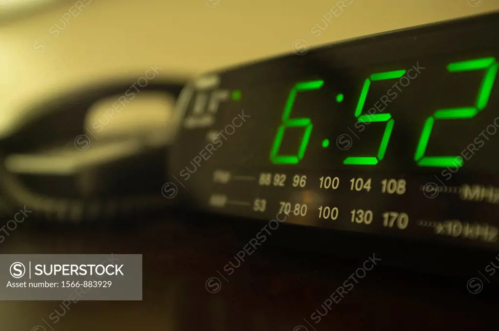 Hotel room nightstand with radio alarm clock and telephone
