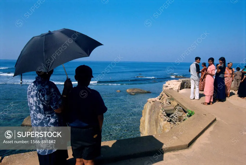 Local people looking sea on old Fort wall, Galle , Sri Lanka