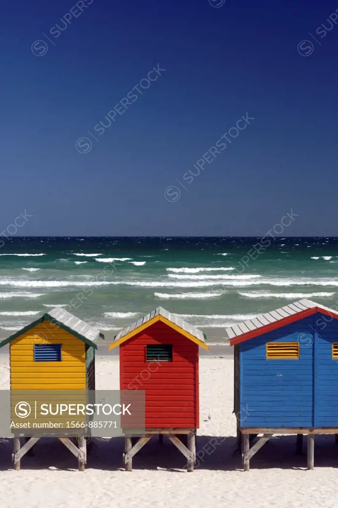 Colorful beach huts at the sandy beach of Muizenberg with blue sky, seen from above, False Bay near Cape Town, South Africa