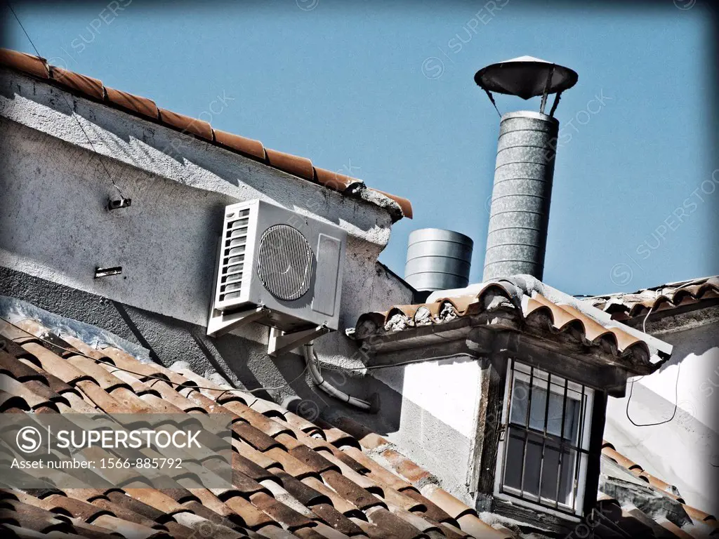 Roof of a house equipped with air conditioning.