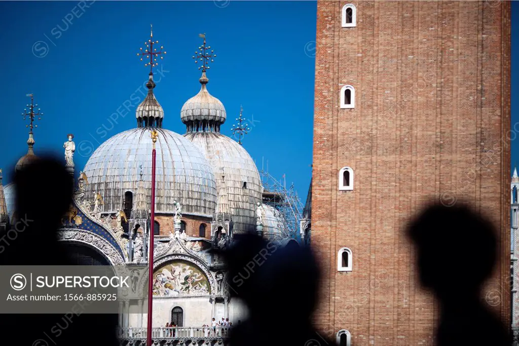 Silhouette of visitors in front of St Mark Basilica, Venice, Italy