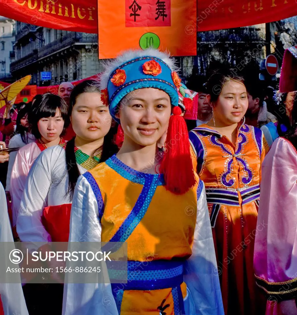Paris, France, Street Scene, French-Chinese Female Teens in Traditional Costumes Parading in Chinese new years Carnival in Street in the Marais Area