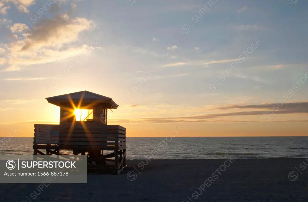 SUNSET OVER GULF OF MEXICO AT VENICE BEACH IN VENICE FLORIDA
