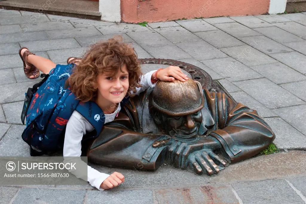 Girl and Bronze Sculpture Man at Work, Bratislava, Slovakia