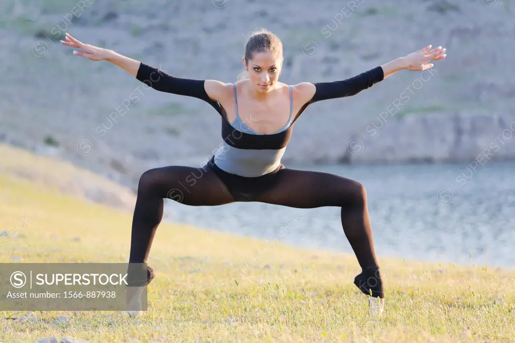 Standing on her tiptoes, attractive ballerina