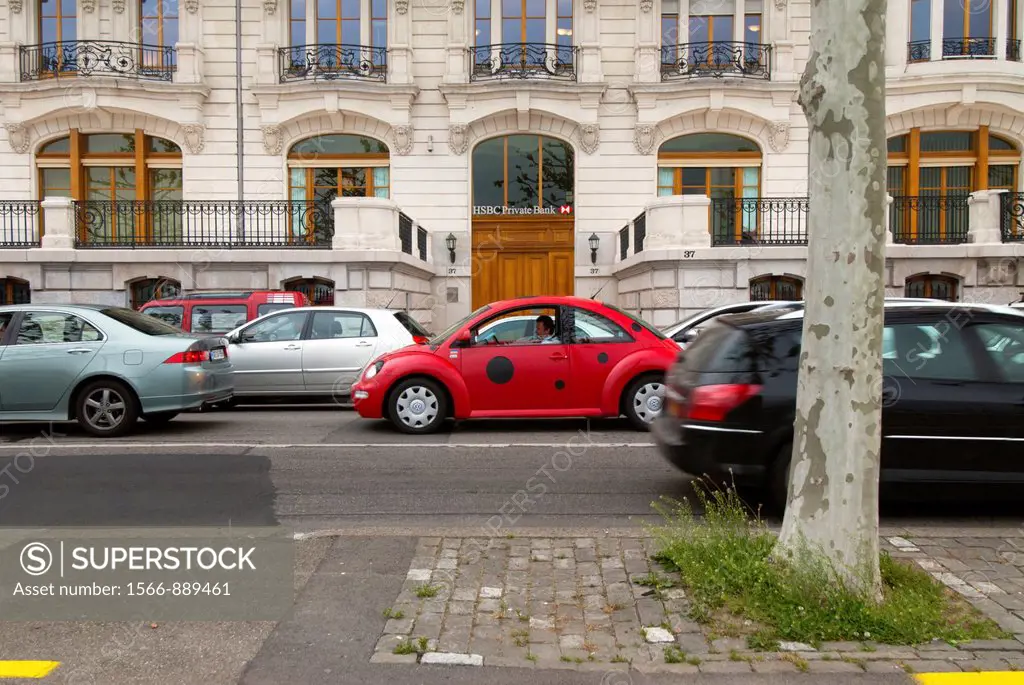 street scene, Quai du Mt Blanc in Geneva, Switzerland, VW Beetle painted as a ladybird in front