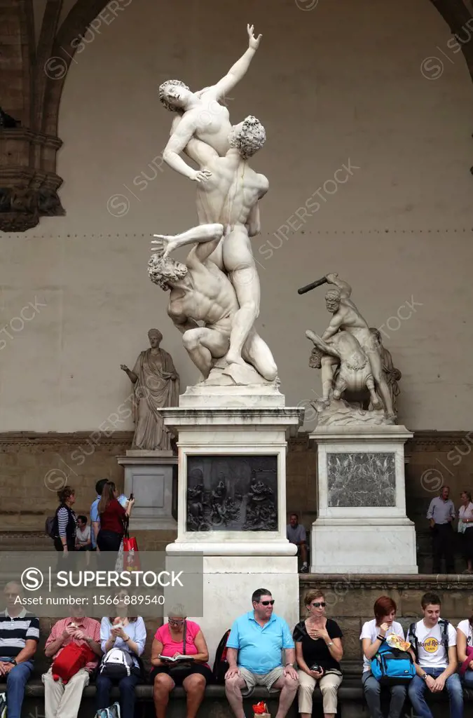 Tourists and statues in Piazza della Signoria, Florence, Italy  Featuring The Rape of the Sabine Women by Giambologna