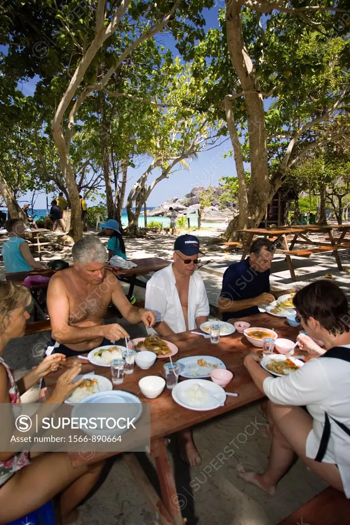 Visitors have lunch under shade trees at beach Similan Island Ko 8 Similan Islands Thailand