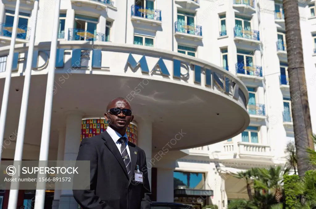 Europe, France, Alpes-Maritimes, Cannes Film Festival. Security guard at the Hotel Martinez during the film festival.
