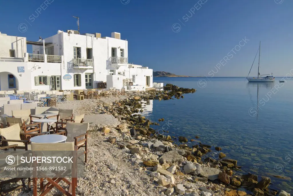 Tables and chairs close to the sea on Naoussa´s Town beach, Paros Island, Cyclades, Greece