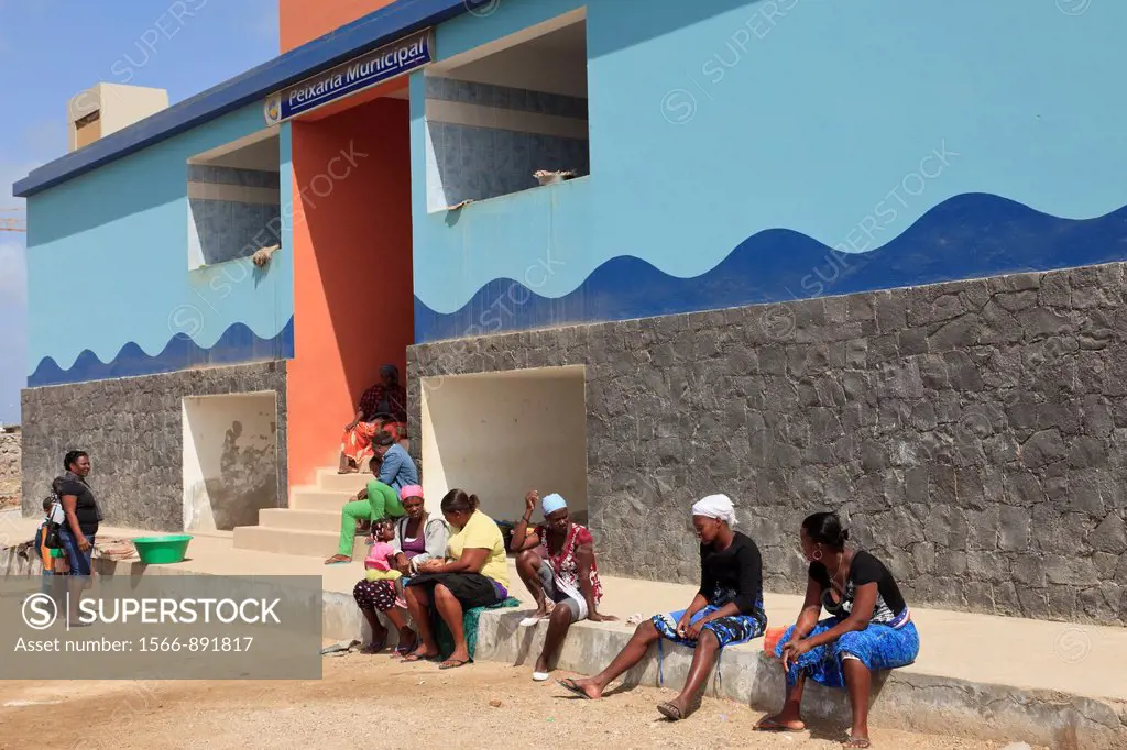 Sal Rei, Boa Vista, Cape Verde Islands, Africa  Port scene with local women sitting outside the municipal fish market
