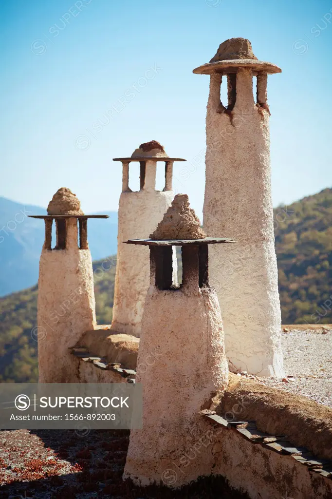 Chimneys on top of a building in Alpujarras de la Sierra, Spain, near the Sierra Nevada National Park