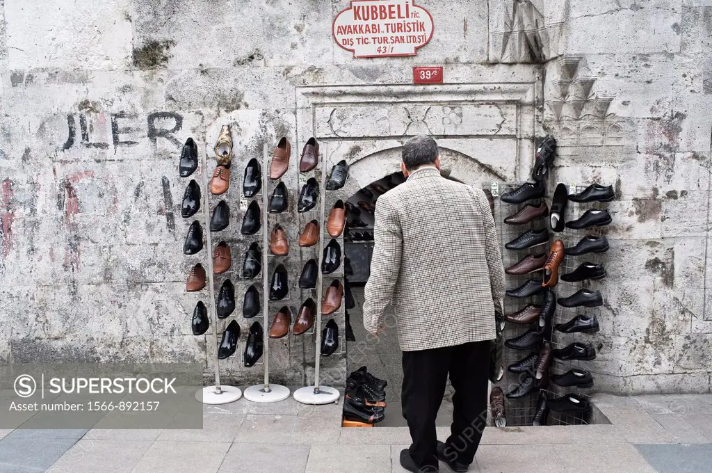 Man looking at shoes store in the street of istanbul, Turkey