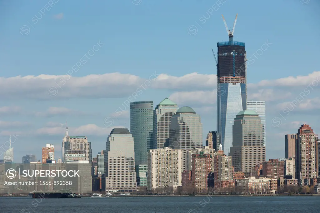 The rising One World Trade Center Freedom Tower and Manhattan skyline in New York City as viewed from New York Harbor