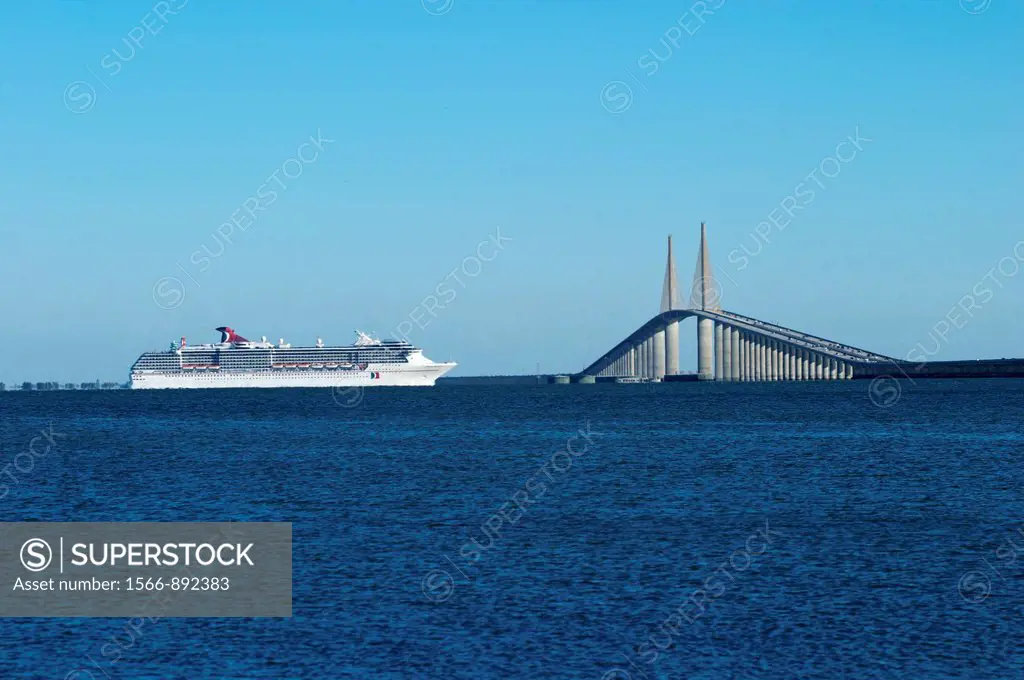 Cruise shio passing under the Sunshine Skyway Bridge over Tampa Bay in Florida  A cable-stayed concrete bridge with a precast deck superstructure  Fin...