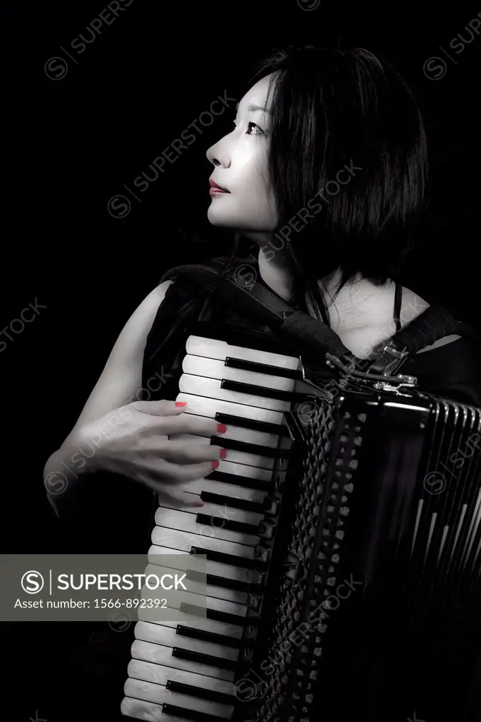 young woman playing accordion