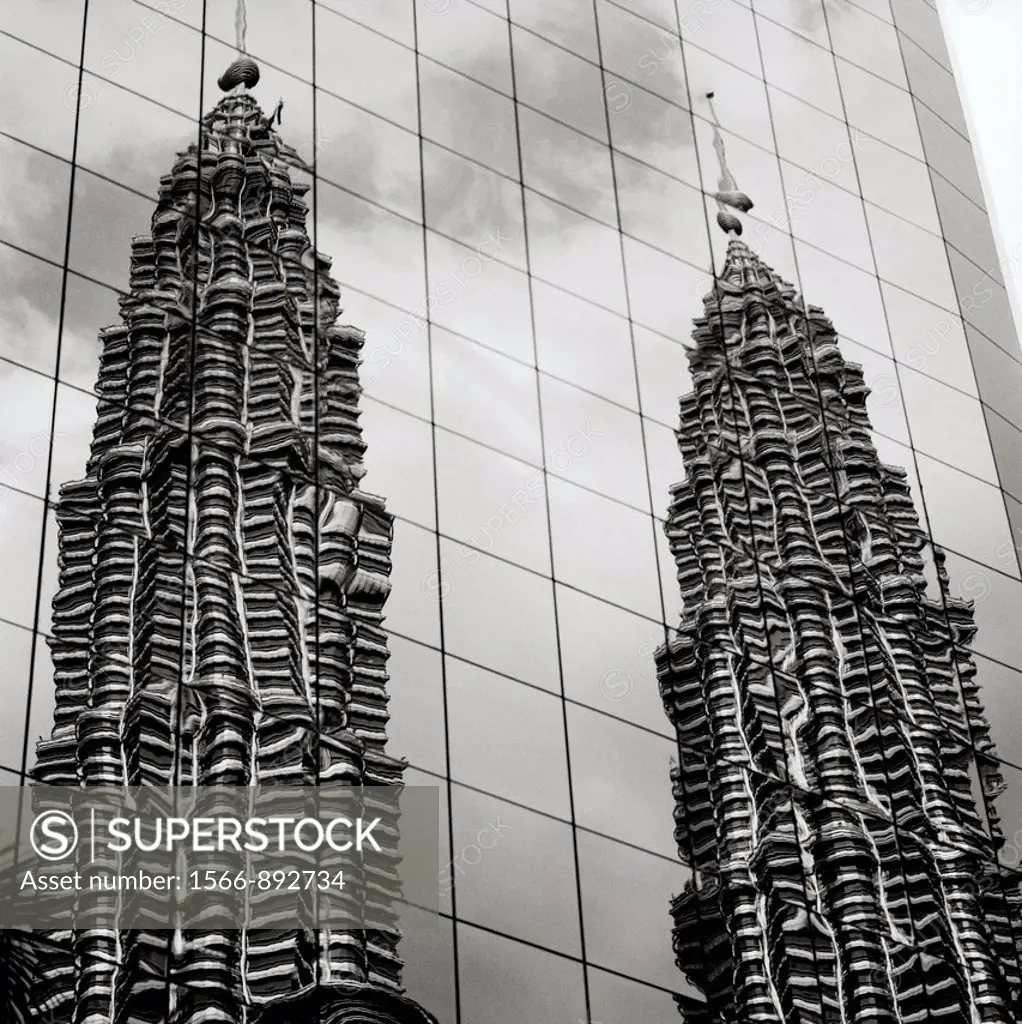 A reflection of the Petronas Towers in Kuala Lumpur in Malaysia in Southeast Asia Far East.