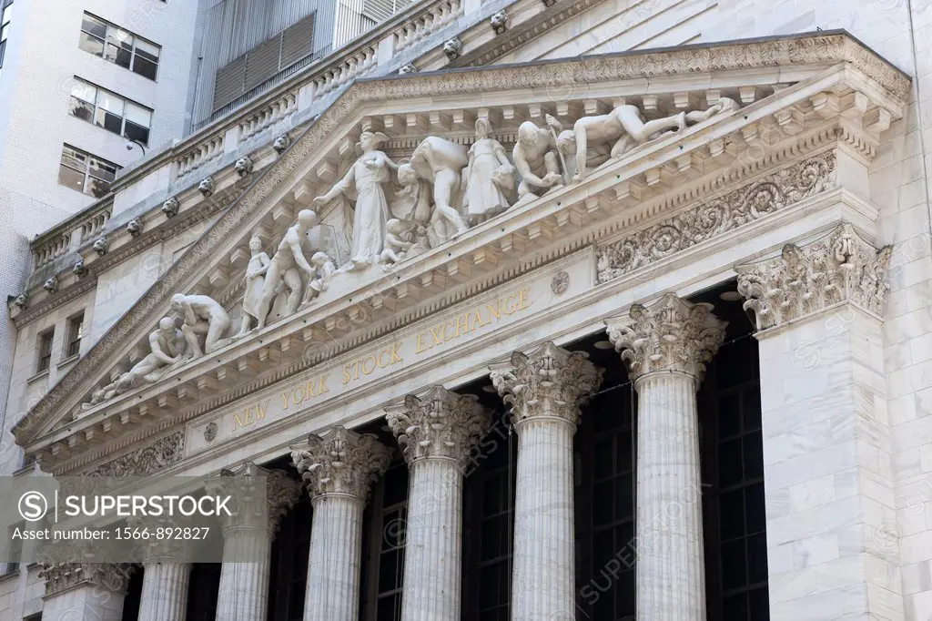 The neoclassical New York Stock Exchange on Wall Street featuring the pediment ´Integrity Protecting the Works of Man´. The Stock Exchange is located ...